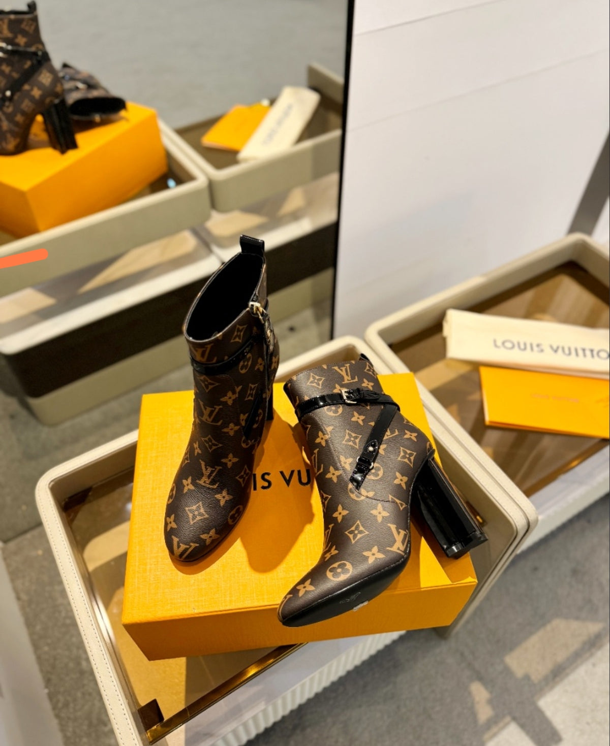 LOUIS VUITTON MONOGRAM BELTED ANKLE BOOTS