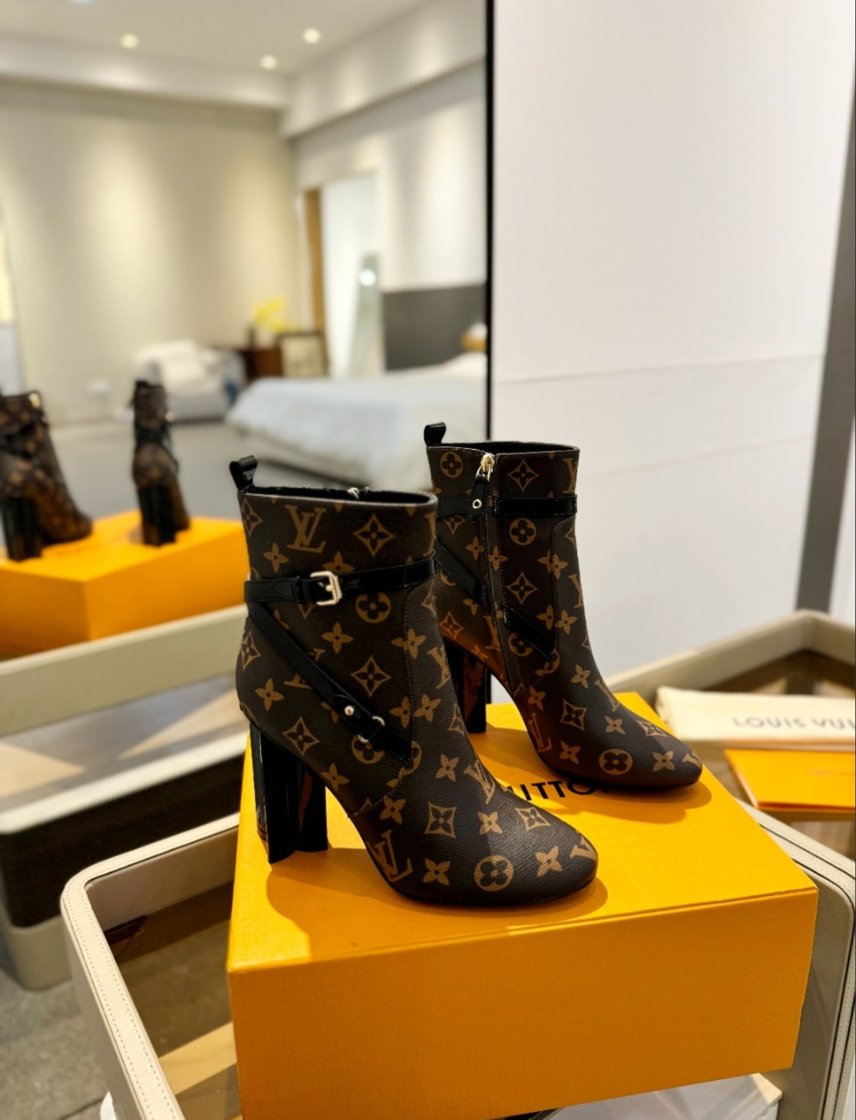 LOUIS VUITTON MONOGRAM BELTED ANKLE BOOTS