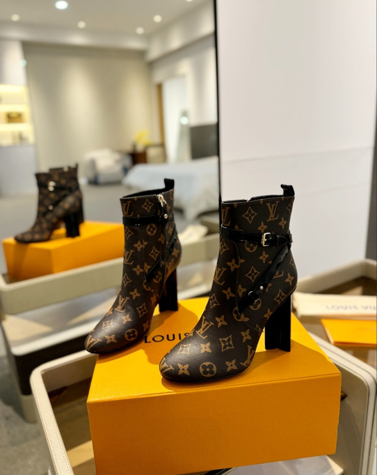 LOUIS VUITTON MONOGRAM BELTED ANKLE BOOTS