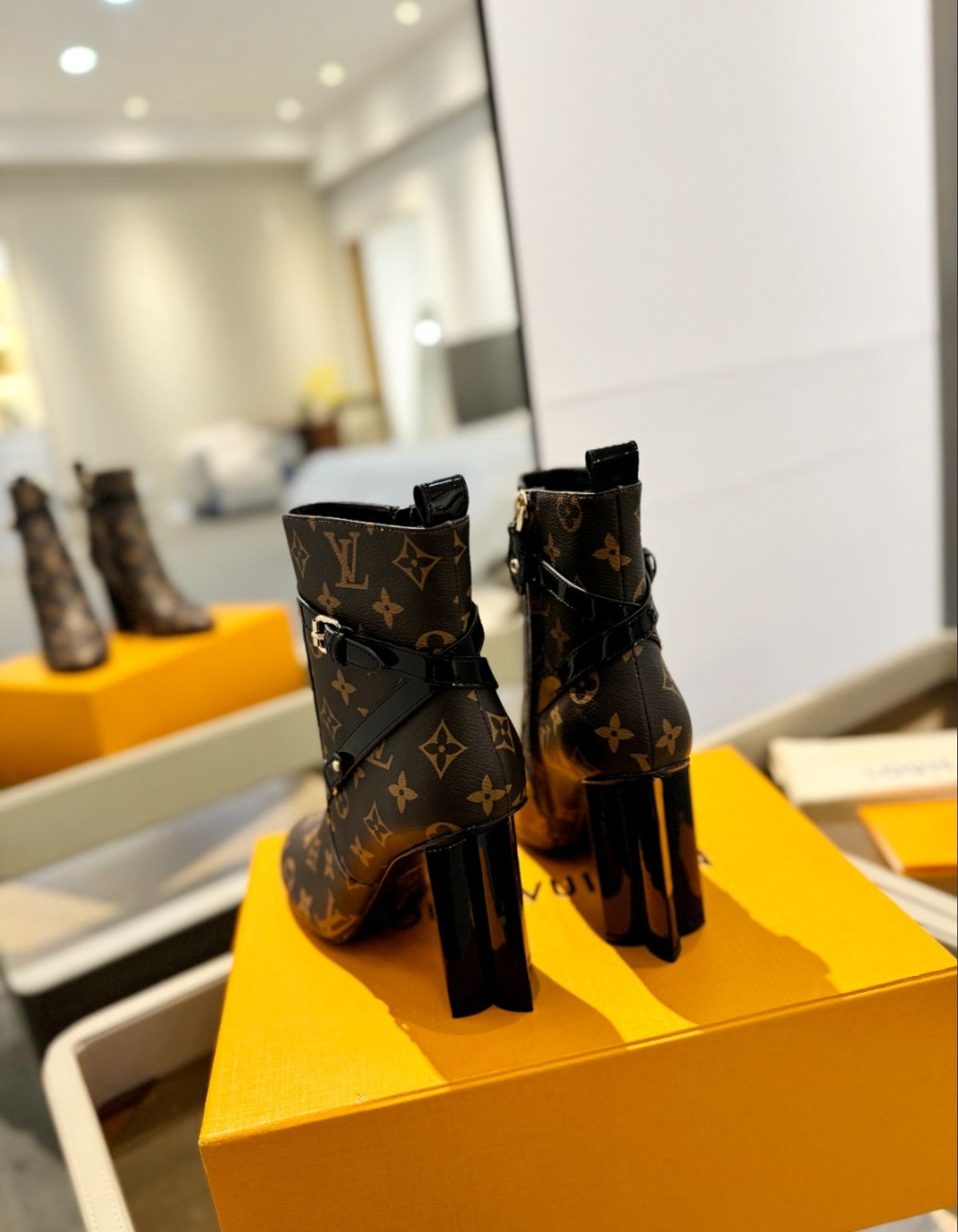 LOUIS VUITTON MONOGRAM BELTED ANKLE BOOTS