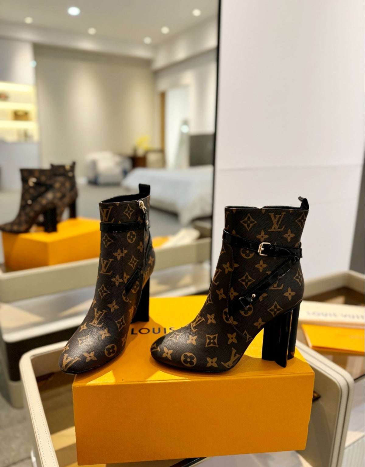 LOUIS VUITTON MONOGRAM BELTED ANKLE BOOTS